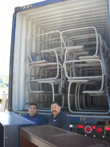 Shipping container loaded with Bellarmine desks, ready to be closed, sealed, and shipped.