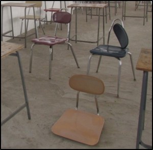 Before: A classroom in Jamaica. In some of our projects, IRN desks and chairs have replaced rocks and treestumps.